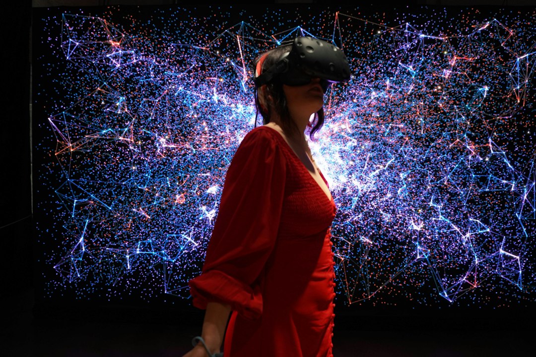 A person wearing virtual reality goggles representing immersive world technology